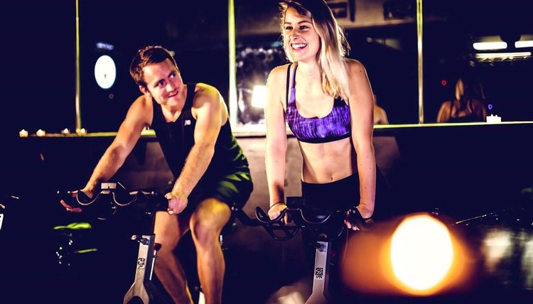 couple indoor cycling