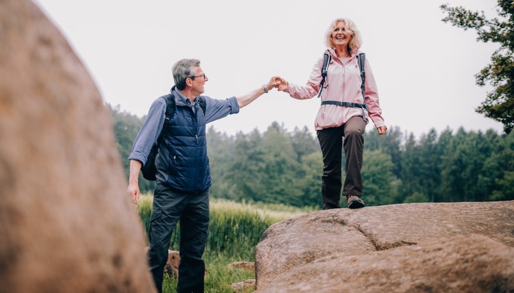 cute senior couple walking in nature