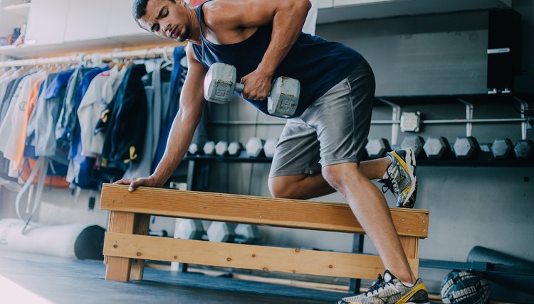 man lifting weights