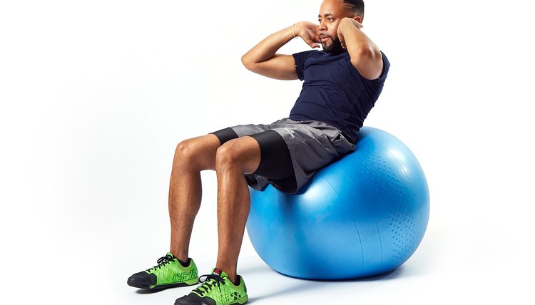 man doing crunches on an exercise ball