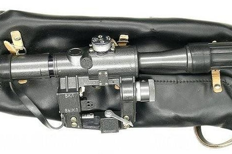 A modern rifle scope in its case.