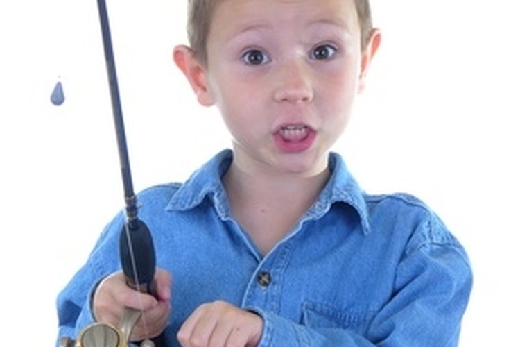 boy with a fishing rod two image by Paul Moore from Fotolia.com A fishing rod holder will keep your lines tangle free.
