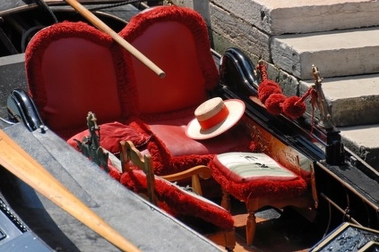 VENITIAN GONDOLA image by Pierre HELGER from Fotolia.com Ratty vinyl boat upholstery can be replaced with simple tools