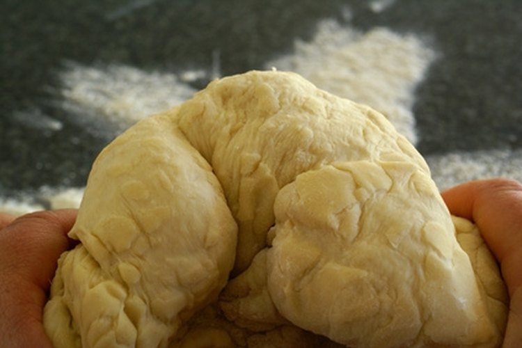 Kneading yeast dough image by Elzbieta Sekowska from Fotolia.com Make a basic dough as a base for creating your own fishing bait.