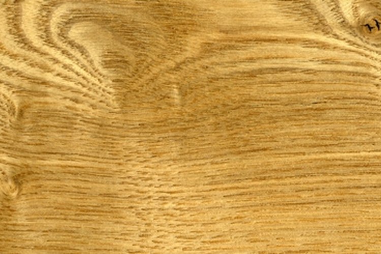 wood texture image by Aleksey Bakaleev from Fotolia.com Paint wood veneer with the proper steps.