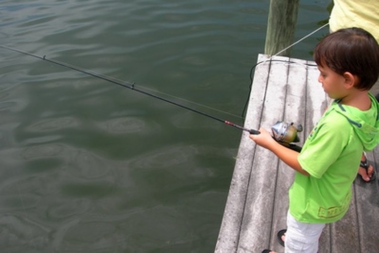 boy fishing image by jedphoto from Fotolia.com Spincast reels are perfect for children.