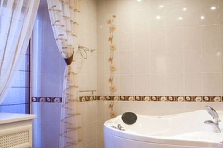 bathroom image by Mikhail Olykainen from Fotolia.com Mold and mildew odors can develop in bathrooms.