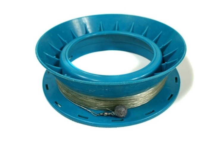 fishing reel image by Brett Mulcahy from Fotolia.com Attach a barrel swivel to your line with a Uni knot.