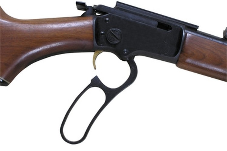 1178 - détail de winchester (détourage inclus) image by Michel Bazin from Fotolia.com Mounting a scope on a lever action rifle greatly improves accuracy.