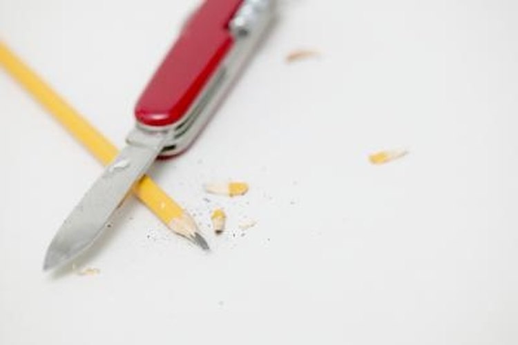 Jupiterimages/Photos.com/Getty Images Keep your pocketknife sharp using a two-side whetstone.