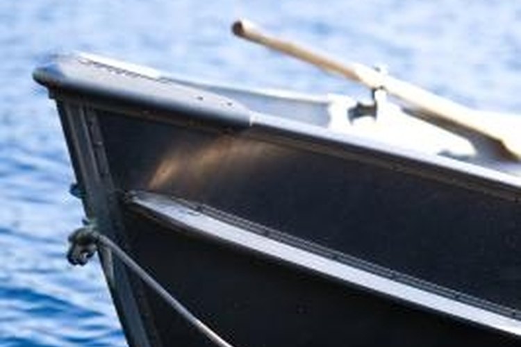 Jupiterimages/Photos.com/Getty Images Over time the rivets in an aluminum boat can work loose and cause a leak.