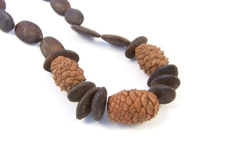 cone necklace image by Alex White from Fotolia.com A sliding knot will keep a necklace together.