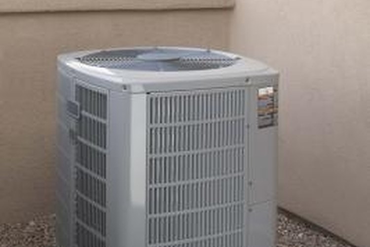 Jupiterimages/Comstock/Getty Images Learn to test the electric capacitor before operating your air conditioner.