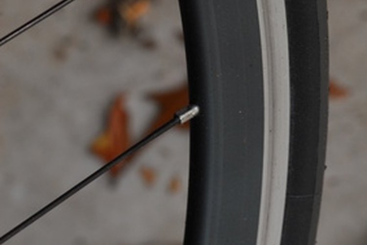 bicycle wheel image by jimcox40 from Fotolia.com Bike tires come in several different styles.