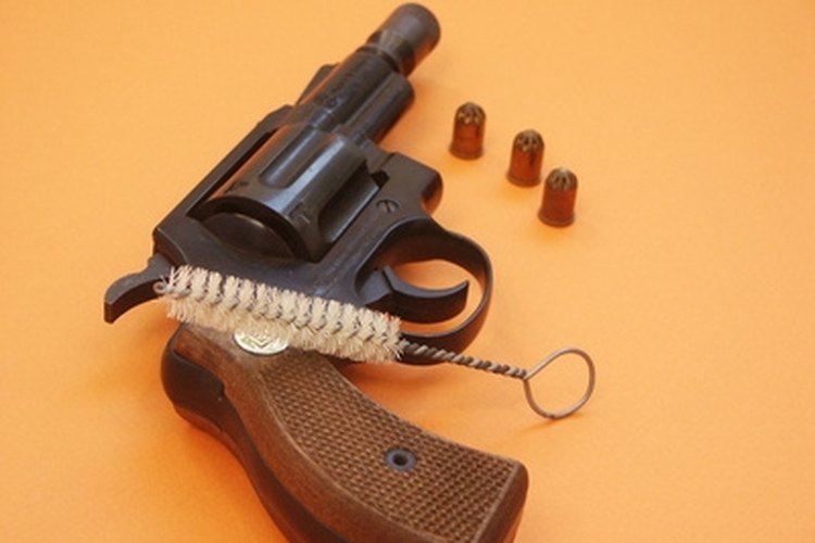 pistol image by Lani from Fotolia.com Practice gun safety at all times.
