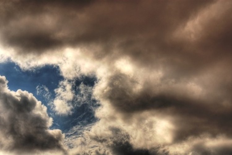 storm clouds 2 image by Paul Moore from Fotolia.com Bad weather can force you into setting up an emergency tarp shelter.
