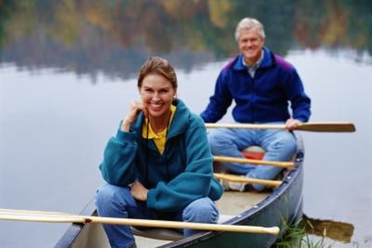 Thinkstock Images/Comstock/Getty Images If you need extra stability, add outriggers to the canoe.