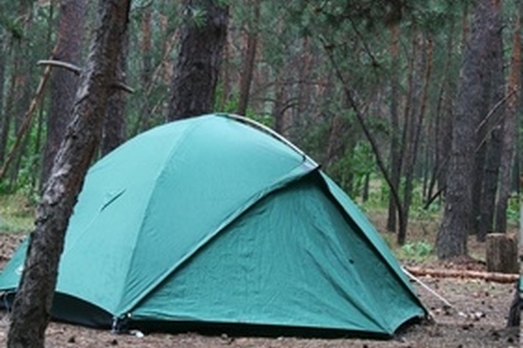 tent on the forest image by Galyna Andrushko from Fotolia.com A tent heater can keep you warm during cold nights.