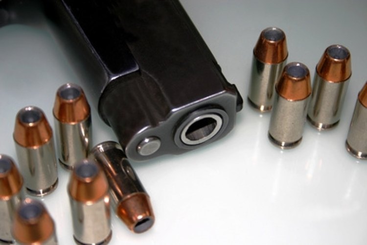 the devil"s right hand image by Lee O"Dell from Fotolia.com Field strip a Colt 1911 for maintenance and cleaning.