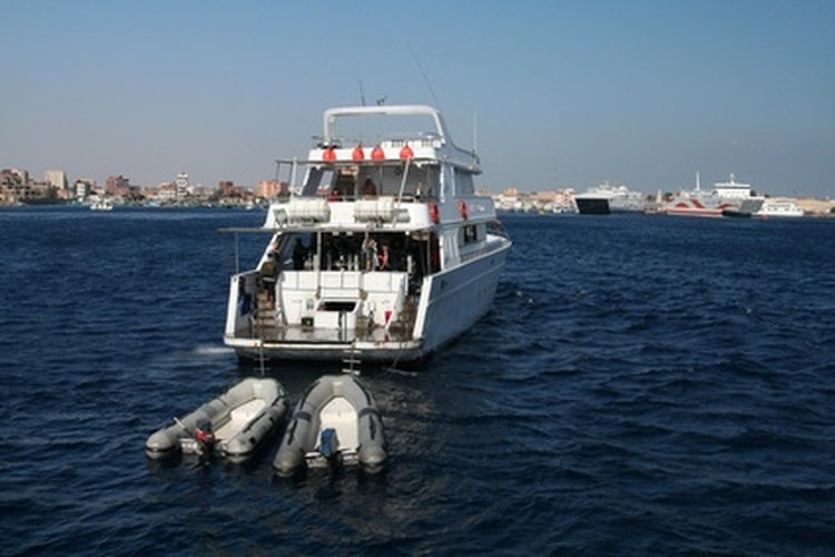 diving boat image by Marcin Wasilewski from Fotolia.com Diving compressors are safest if bolted to a dive boat's deck.