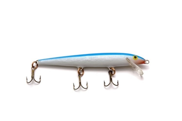 fishing lure image by Brett Bouwer from Fotolia.com Use a three step process to paint wooden lures.