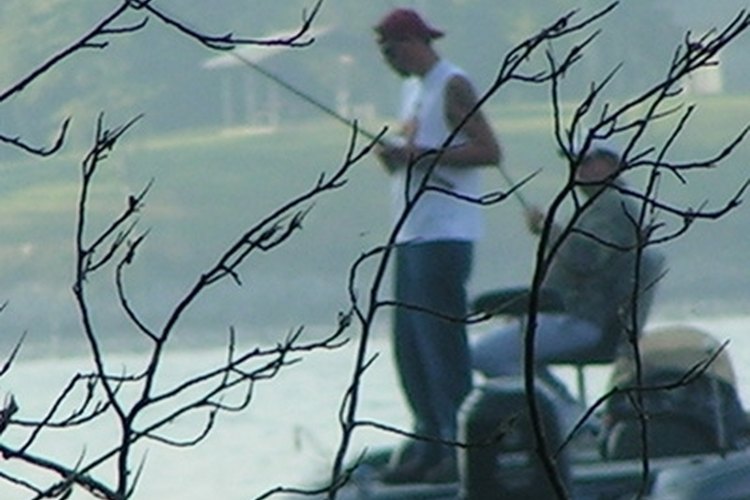 fishing image by Topcat from Fotolia.com The flipping feature on a baitcast reel allows anglers to make precise casts.