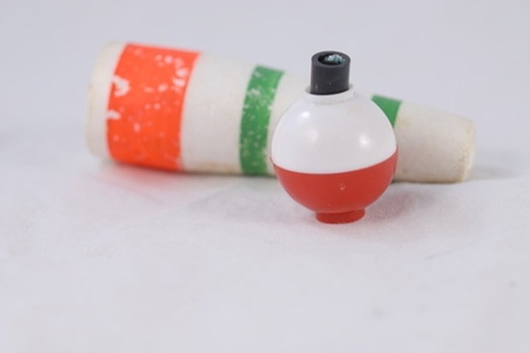 fishing bobbers image by jimcox40 from Fotolia.com Slip bobbers slide along your fishing line, unlike a clip bobber (pictured in front.)