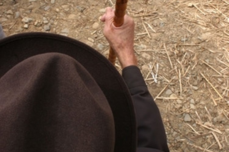 old man holding his walking cane image by Gina Smith from Fotolia.com Walking canes for hiking can easily be made at home.