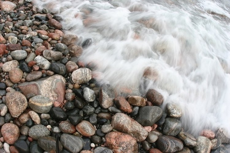 water motion flowing lake superior rocks agate col image by Paul Retherford from Fotolia.com Search for Lake Superior agates in surrounding areas with many pebbles and rocks.
