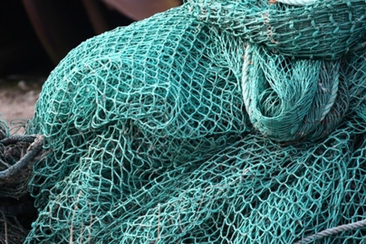 fishing net on a boat image by jeancliclac from Fotolia.com Instead of buying commercial fishing nets, you can make your own fishing nets customized to your needs.