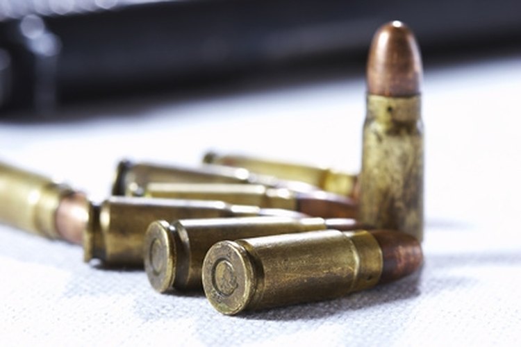 shell image by AGphotographer from Fotolia.com A machine gun can fire multiple rounds with one pull of the trigger.