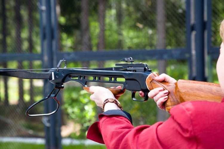 Woman crossbow shooting image by Igor Zhorov from Fotolia.com The owner of a crossbow should know how to install replacement strings.