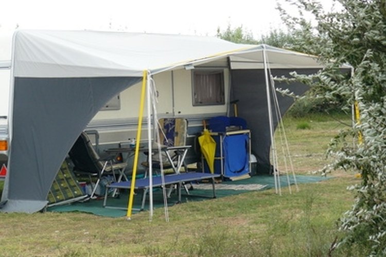 Camping - Auvent image by albillottet from Fotolia.com Tent trailer awnings make camping more comfortable.