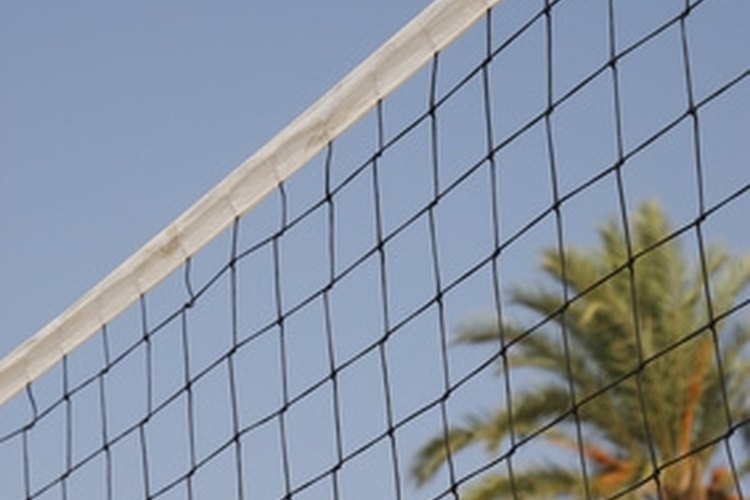 volleyball net with palm trees in the backgound image by jeff gynane from Fotolia.com Build your own high-quality and portable volleyball net
