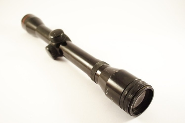 sniper image by glgec from Fotolia.com You can sight in your rifle scope through several different techniques.