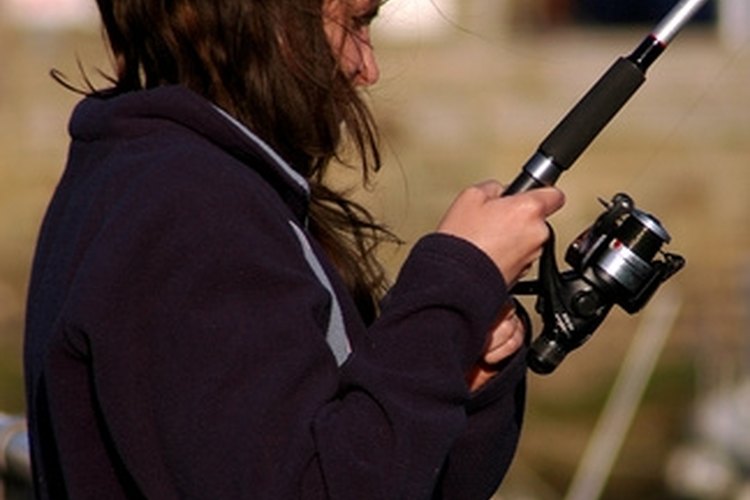 female fishing image by JulianMay.co.uk from Fotolia.com Fishing guides work with clients of a variety of ages and skill levels.