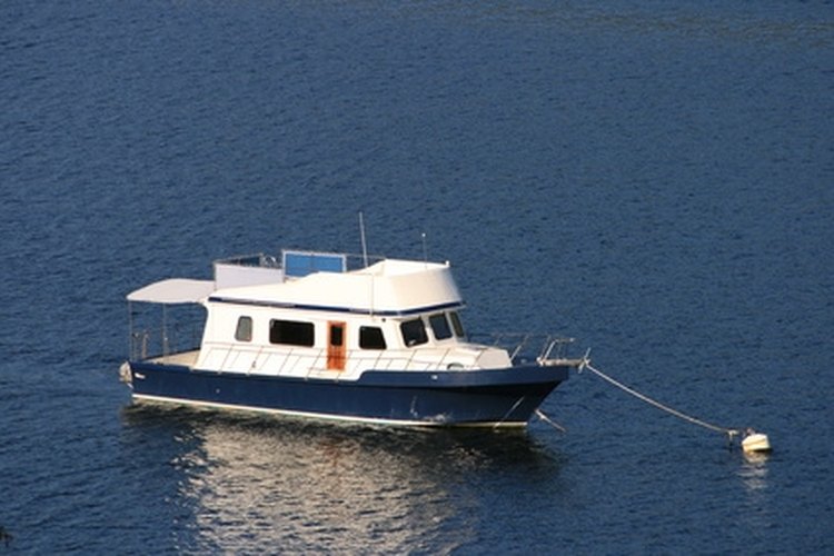 anchored boat image by John Hurford from Fotolia.com Make sure your engine will start by putting in an extra battery.