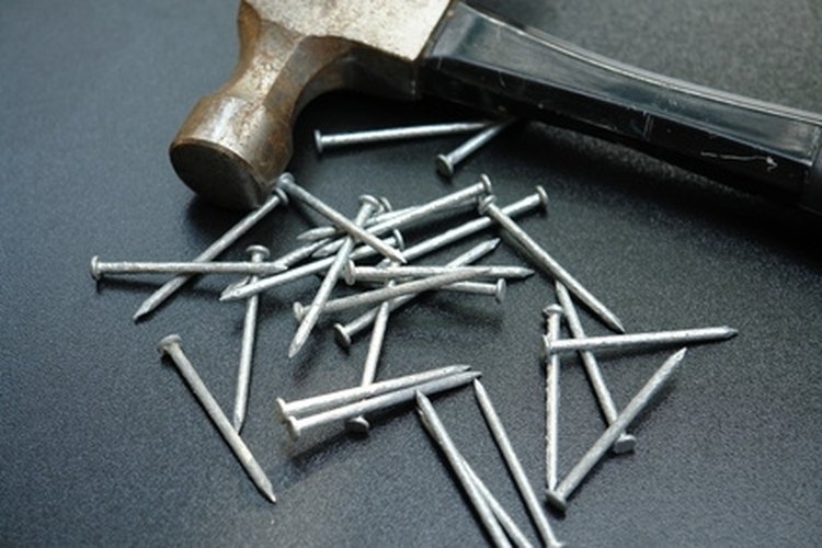 hammer and nails image by Horticulture from Fotolia.com If you know how to use a hammer and nails, you can build a basic lean-to type cabin.