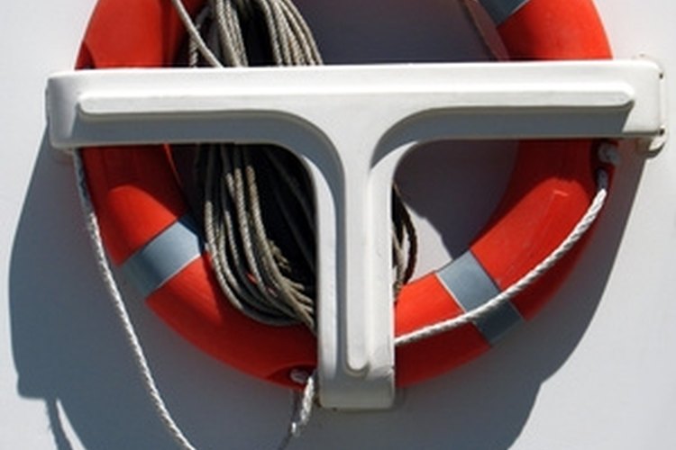 salvavidas image by RAMON CAMI from Fotolia.com Tie a figure-eight knot to secure a line to a ring buoy.