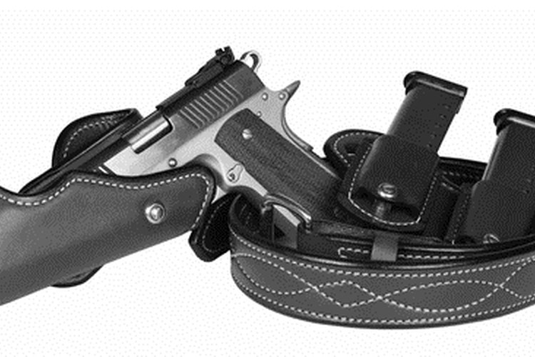 pistol and holster image by Paul Moore from Fotolia.com Holsters come in many shapes and sizes, and they have multiple features.