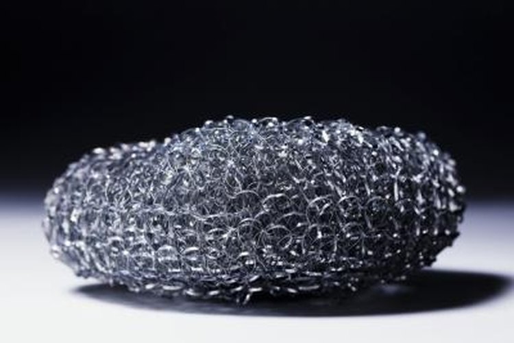 ballyscanlon/Stockbyte/Getty Images Steel wool and metal polish are all you need to polish the slide.
