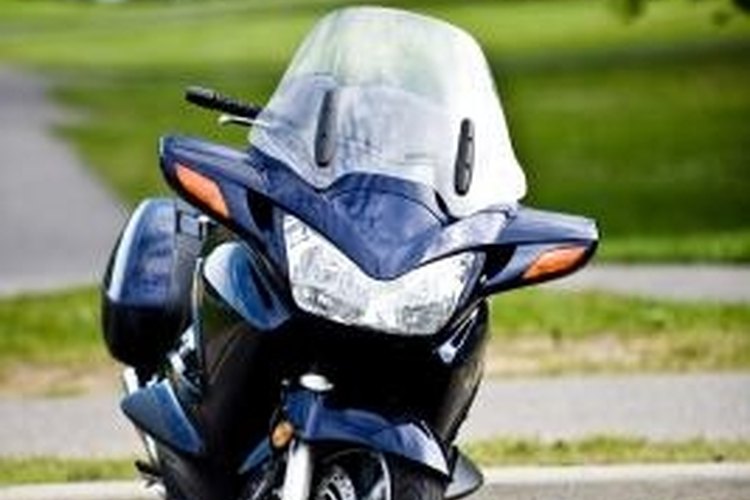 Jupiterimages/Photos.com/Getty Images Repair scratches on a motorcycle fairing on your own.