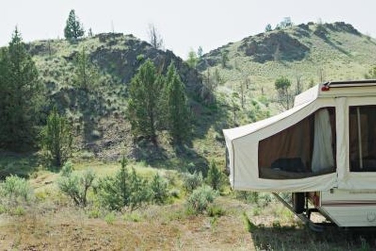 Bryan Mullennix/Digital Vision/Getty Images Save money by repairing your Jayco tent canvas yourself.