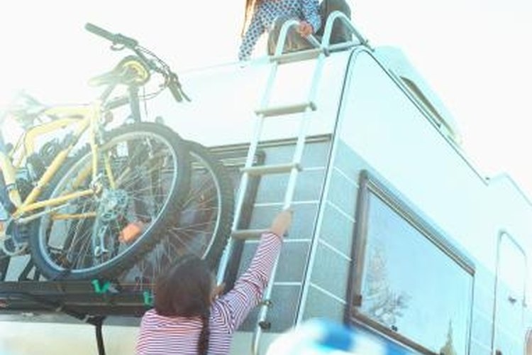 Martin Barraud/Digital Vision/Getty Images Walking on an RV roof can damage it.