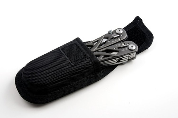 stock pictures of a multi tool folding knife image by Albert Lozano from Fotolia.com Taking a multi-tool apart lets you clean the mechanisms and service the device.