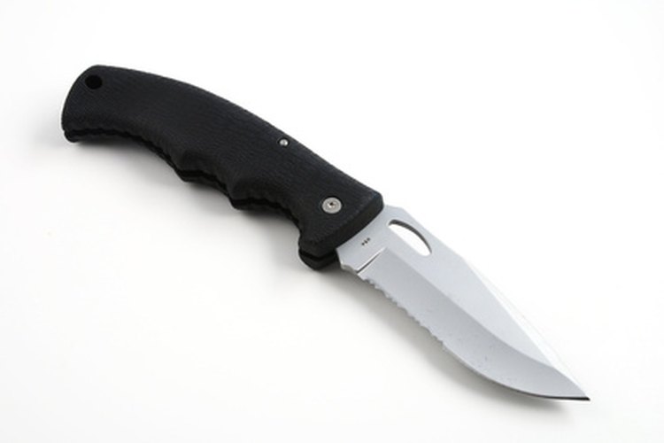 knife image by Albert Lozano from Fotolia.com Learn proper technique when throwing a pocket folding knife.