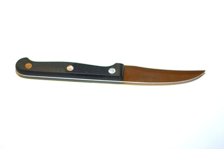 knife image by apeschi from Fotolia.com Keep your knife from rusting by bluing.
