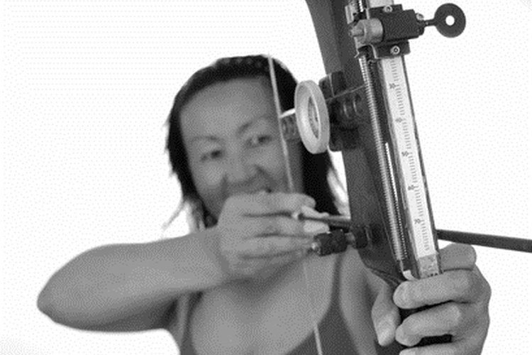 lady archer eleven image by Paul Moore from Fotolia.com Compound bow draw weights can be adjusted to about 10 pounds below the listed weight.