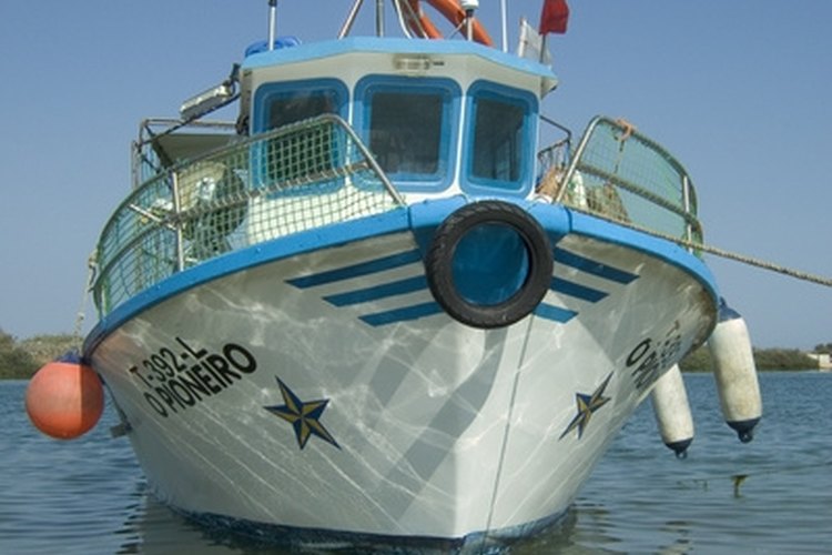 boat 2 image by Rainer Tagwercher from Fotolia.com Boat carburetors are adjusted with the engine running.