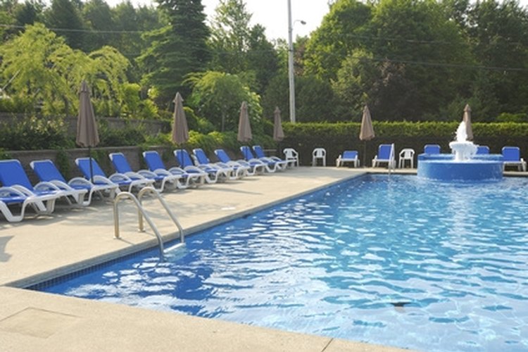 swimming pool image by apeschi from Fotolia.com Swimming noodles are a common sight at pools.